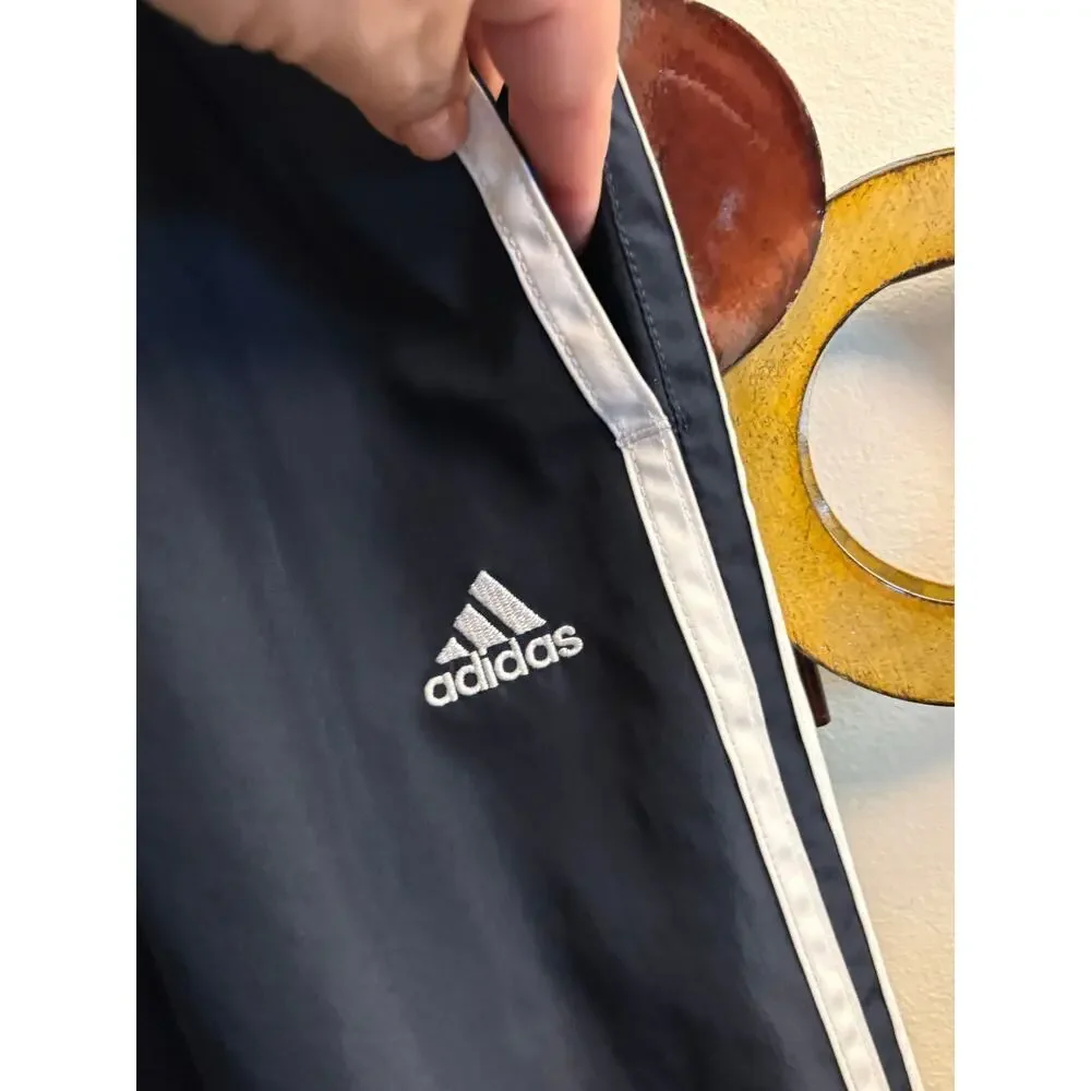 Men’s Adidas black track style pants with mesh lining